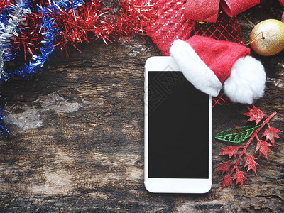 带圣诞帽的智能手机图片