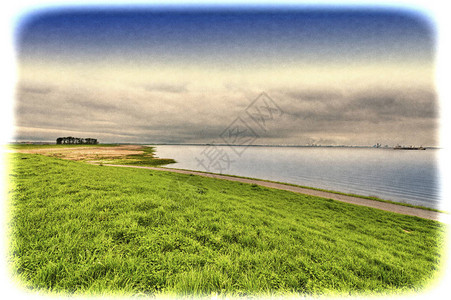 荷兰北海岸的沙丘和大海带堤坝的荷兰景观可防止洪水泛滥复古图片