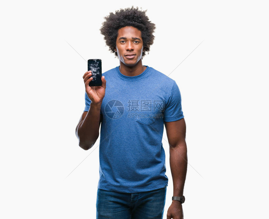 非裔美国人在孤立的背景中持有破碎的智能手机图片