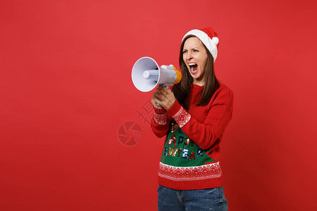 生气恼怒的年轻圣诞老人女孩穿着针织毛衣图片
