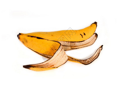 在白色背景上擦伤的香蕉皮黄色图片