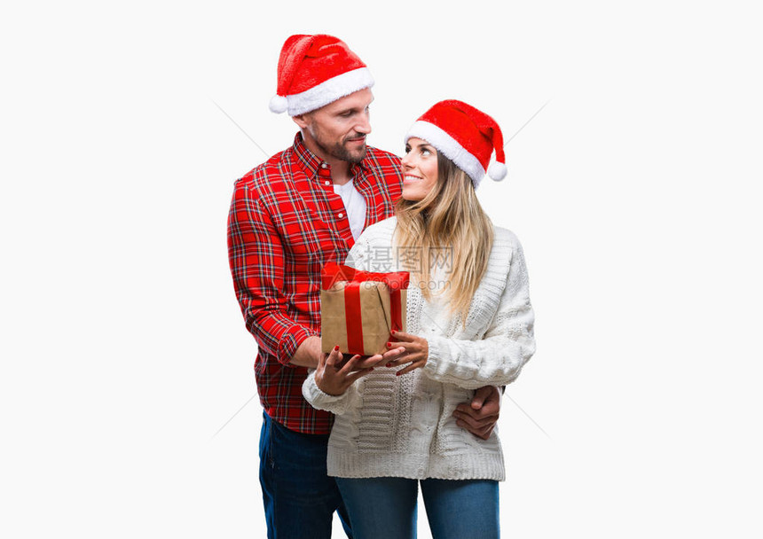 爱的年轻情侣戴着圣诞帽子图片
