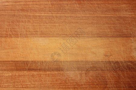 划痕中的木质纹理木材的纹理在划痕处呈深橙色木砧板的质地图片