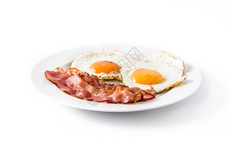 炸鸡蛋和培根早餐在白图片