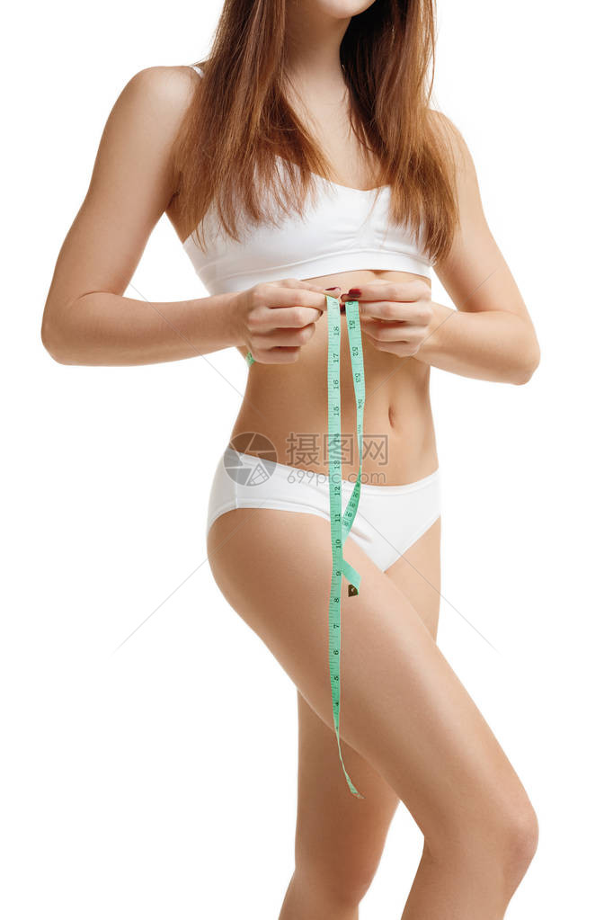 美丽的年轻白种女人用卷尺测量她的身材大小的画像妇女拿着厘米和测量瘦身的大小图像未图片