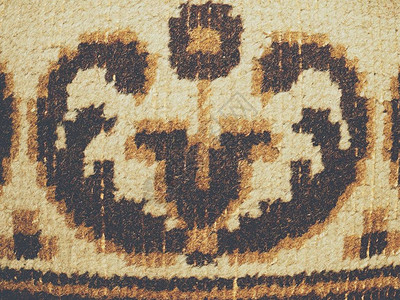 旧地毯纹理的封闭表面布质带淡色背景图片