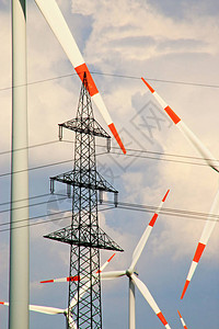 电力塔和风力涡轮机提供替代能源图片