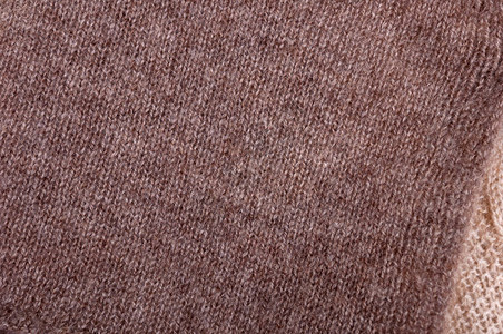 棕色和米色针织羊毛的质地小针织顶视图特写图片