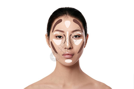 轮廓在白色背景上化成亚洲女面孔粉色和突出化妆专业图片