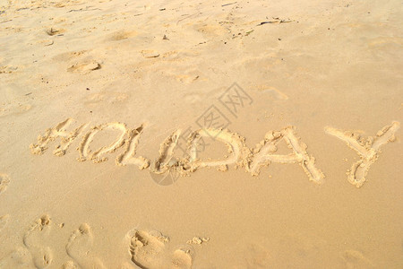 沙滩上的假日标志背景图片