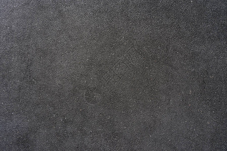 小砾石墙与白色黑色灰石头混合制成建筑物的墙壁或地板用作背景的房图片