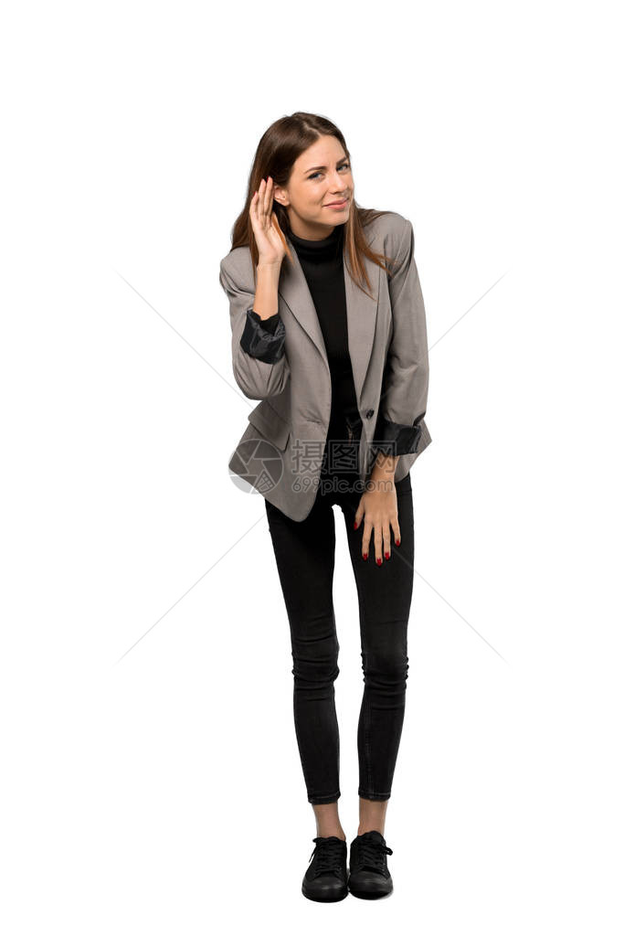 拍到一个商业女商人的一整张照片通过在孤立的白色背景上举起图片