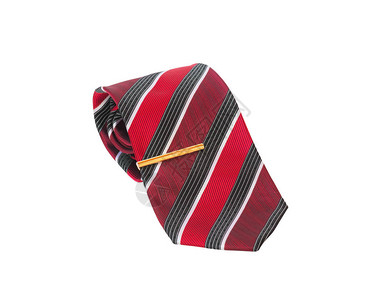 时髦的红条纹领带和金色领带针被白色背景隔绝图片
