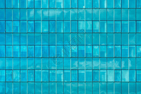 现代办公大楼外部的蓝玻璃窗墙背景当代建筑概念和当代建筑结图片