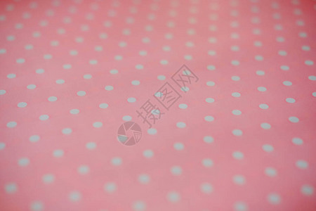 粉红织物和白细小波尔卡点背景图片