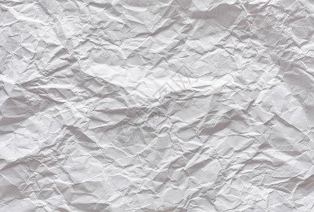 一张皱巴的白纸背景纹理图片