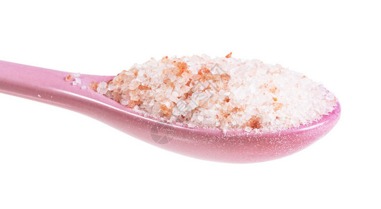粉红色喜马拉雅盐的陶瓷勺侧面视图图片
