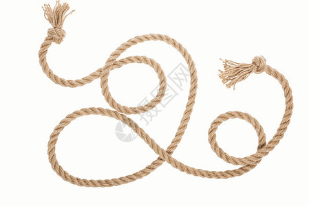黄麻绳有卷曲和结白的背景图片