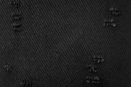 黑色织物纹理用布料制成的深色材料的背景图片