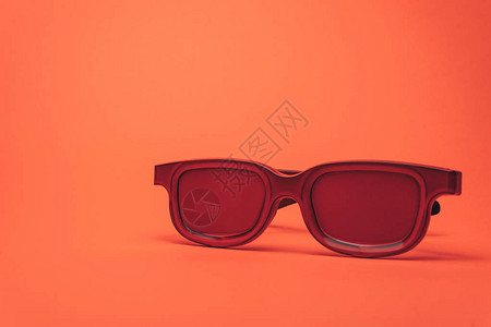 红眼镜印在珊瑚橙色背景图片