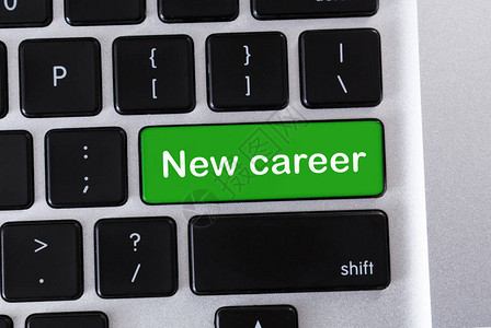 绿色计算机键盘按钮上的新职背景图片