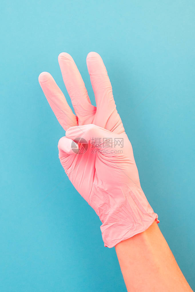 指向三号用粉红色手套在蓝图片