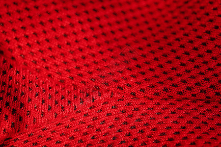 红色运动服封闭顶端视图接缝和切口可透气的编织服装背景图片