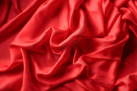 红色丝绸派织物纹理背图片