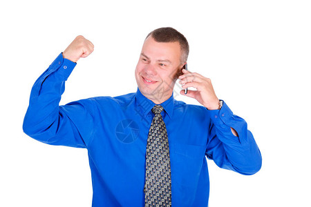 身穿蓝色衬衫和领带的成功商人用手机说话图片