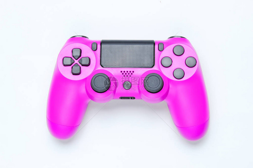 灰色背景的现代粉红色塑料游戏板joystick图片