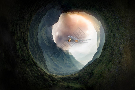 飞机的梦想旅行是从绿色山洞的入口飞过高清图片