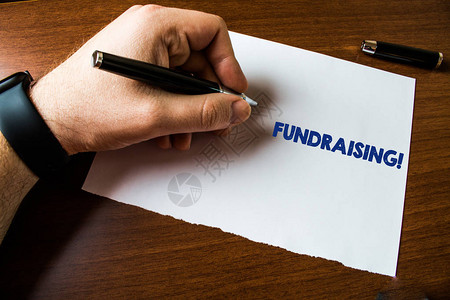概念手写显示筹款寻求为慈善或事业产生财政支持的概念意义人左手表纸圆珠图片