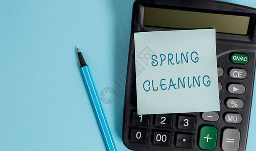 概念手写显示春季大扫除春季彻底清洁房屋的概念意义实践电子计算器便笺图片