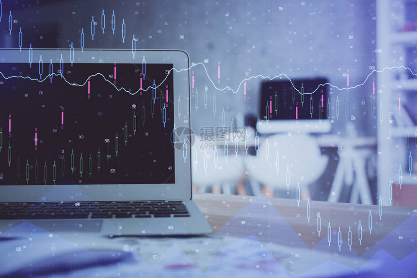 金融市场图表全息图和个人计算机背景图片