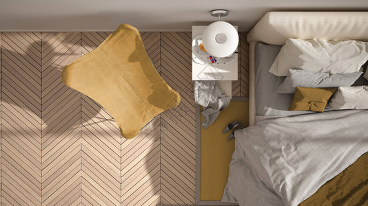 现代黄色简约卧室带枕头和毯子的床人字形镶木地板床头柜扶手椅和地毯图片
