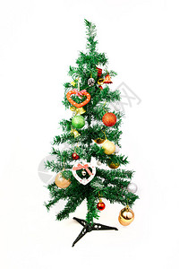 圣诞假期背景与冷杉树枝和五颜六色的装饰品在圣诞节图片