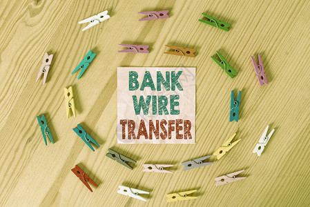 显示银行电汇的概念手写概念含义通过银行到银行的电子转账彩色皱纸木图片