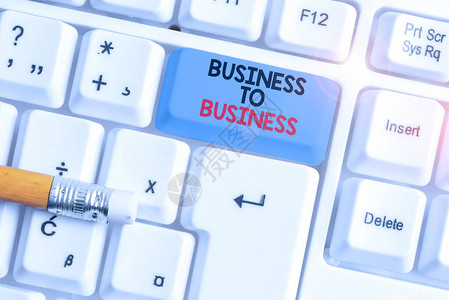显示企业对企业的书写笔记两家企业之间商业交易的商业概念白色pc键盘图片