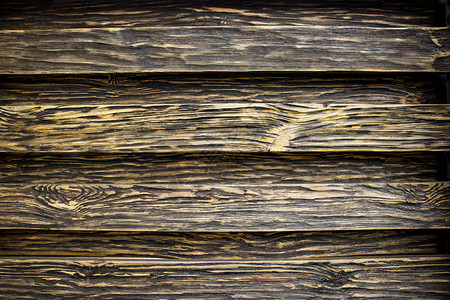 老化的木材纹理板是黑色和棕色的人工老化的木材质地深沉一图片