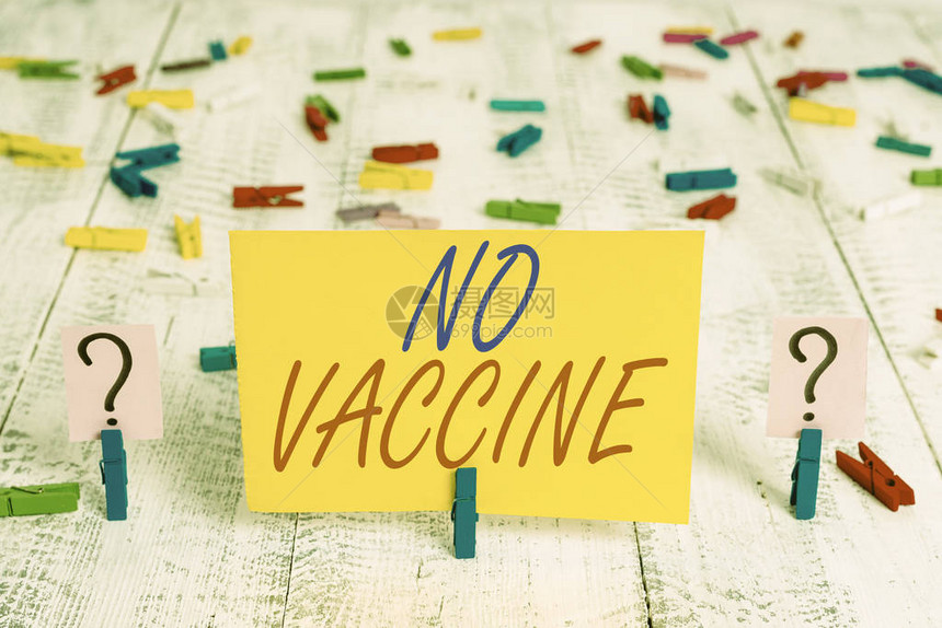 写笔记显示没有疫苗不提供对一种或几种疾病的免疫力的商业概念木桌上放有图片