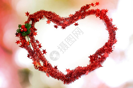 用于装饰红本底心脏形状的圣诞红喜舞赛空图片