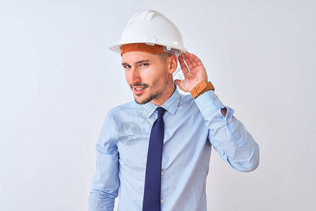 年轻的商人戴着承包商安全头盔图片