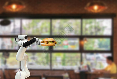 自兴人工智能智能机器人食品在餐厅里拿着汉堡包未来机器人自背景