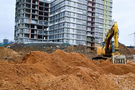 大亮黄色强力工业重型挖掘机拖拉机推土机大城市新微区建设期间道路维修背景图片
