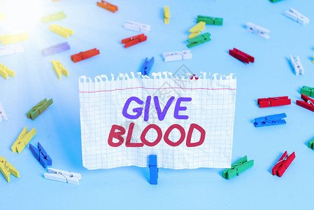 概念手写显示献血概念意义展示自愿抽血并用于输血彩色衣夹纸空提醒蓝图片