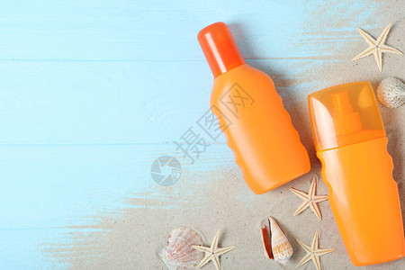 沙子贝壳海星和防晒产品顶视图保护皮肤图片