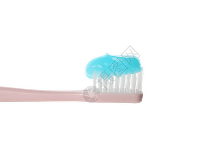 牙刷与牙膏隔离在白色背景图片