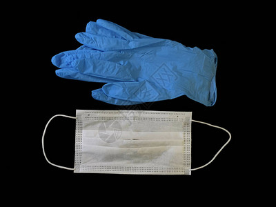 黑色背景上的医用手套和防护面罩预防冠状感染Covid19理念图片