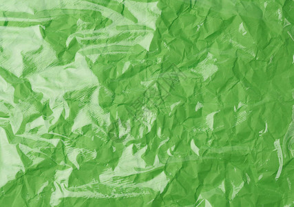 为包装产品在绿色背景完整框架封闭的包装产品制作透明拉伸塑料图片