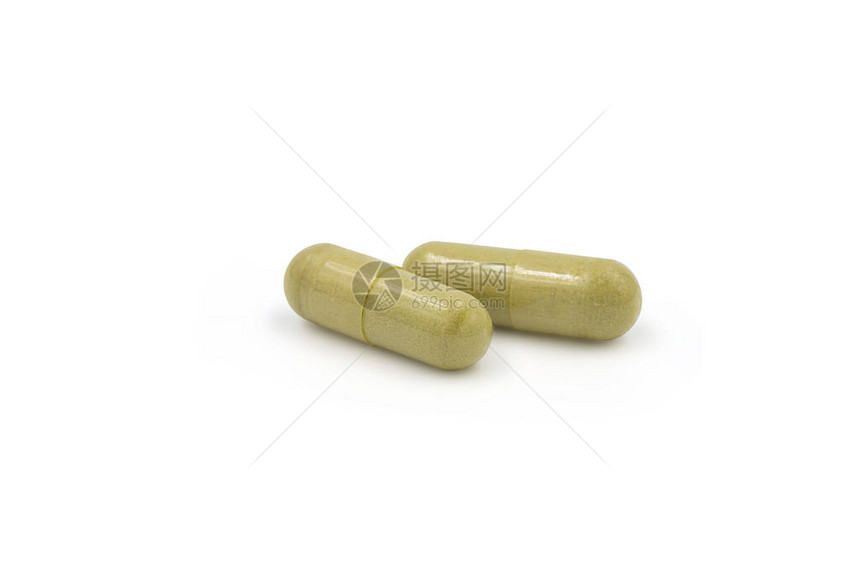 绿色穿心莲丸胶囊白色孤立背景与剪切路径复制空间用于治疗电晕或covid19的草药替代药物药图片